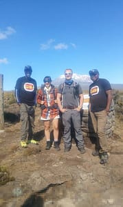 climbers preparing for Mount Kilimanjaro trek with gear and equipment in Tanzania